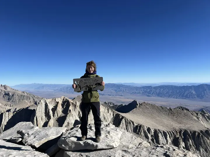 Tony holding the Mount Whitney summit sign